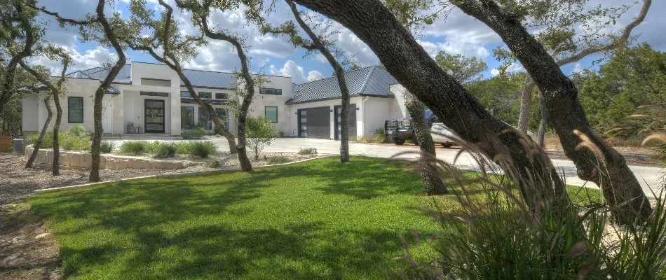 Green lawn in Texas with trees.