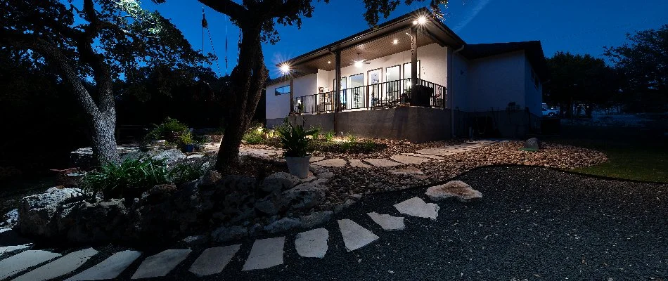 Outdoor living space in Bulverde, TX, with landscape lighting.