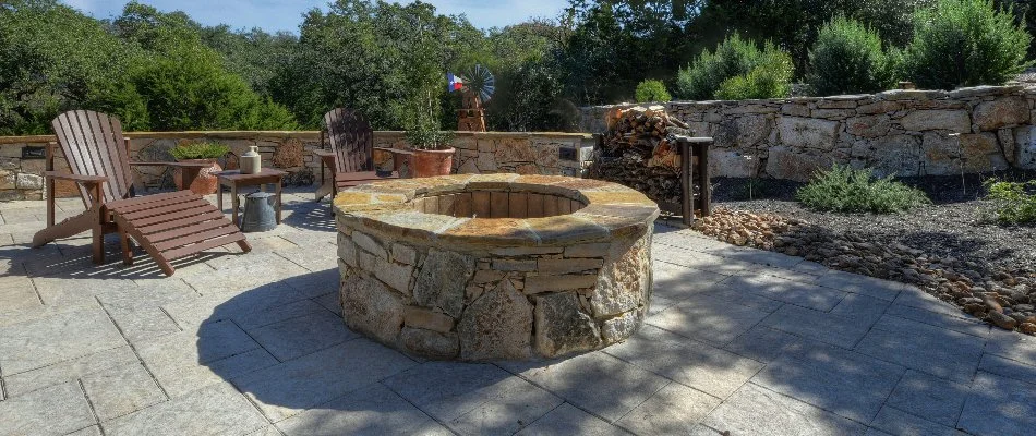 Round fire pit on a patio in New Braunfels, TX.