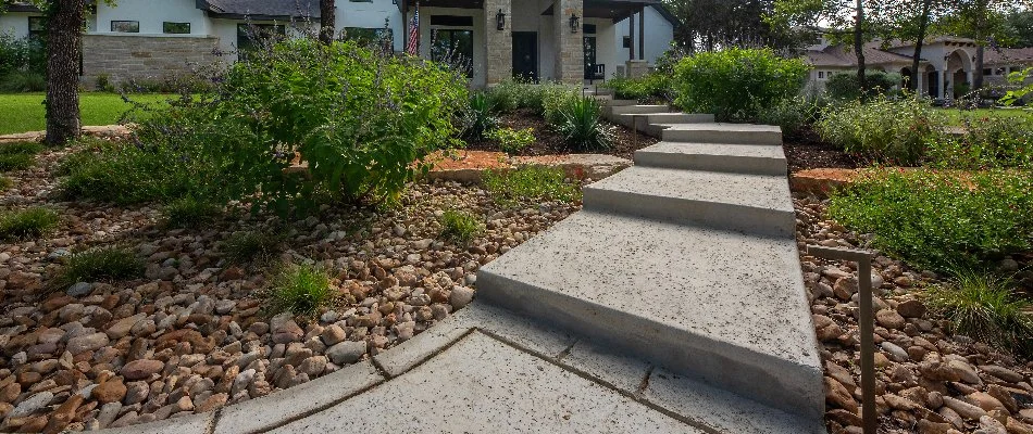 Outdoor steps, retaining wall, and walkway in New Braunfels, TX.