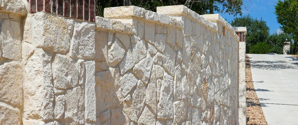 Retaining wall in New Braunfels, TX, made of stone.