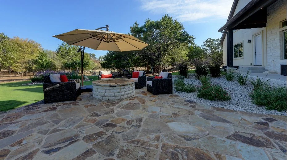Black mulch and green shrubs in landscape bed in Spring Branch, TX.